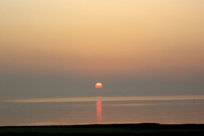 Sonne versinkt in den Schattendunst